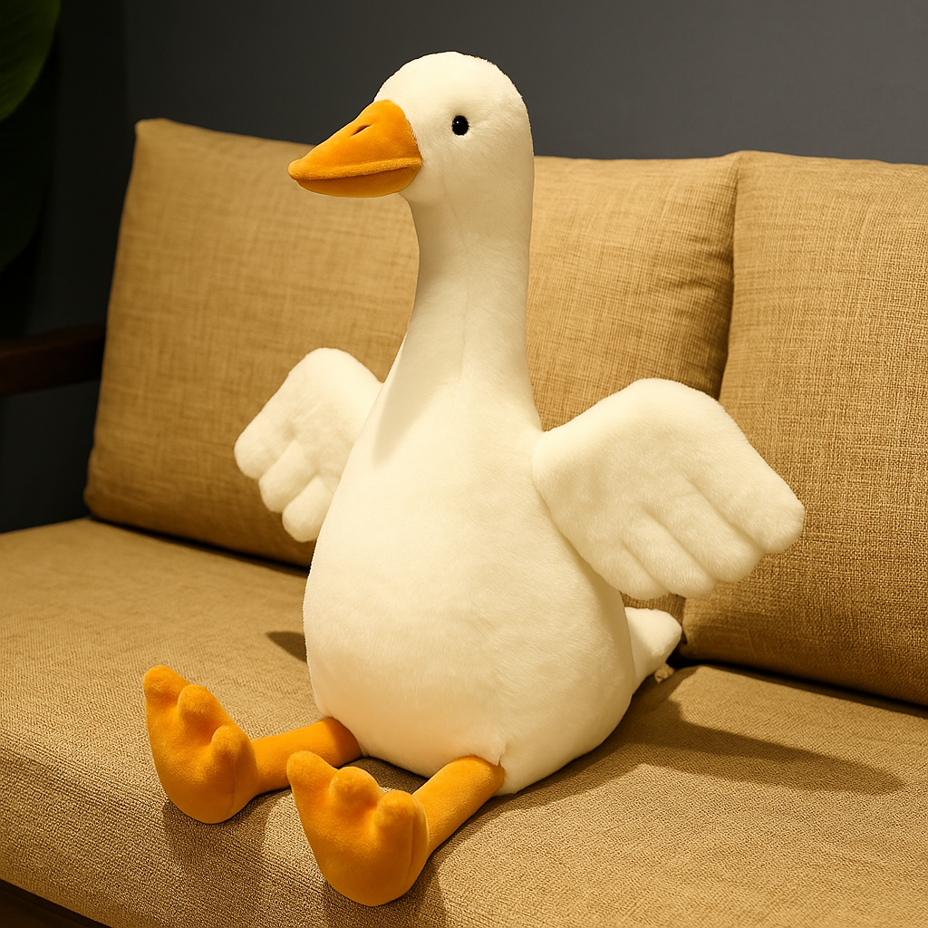 white goose plush sitting on a couch